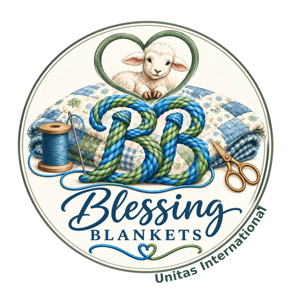 Blessing Blankets — lamb in a heart above handmade quilts and yarn